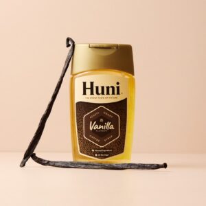 Bottle of huni vanilla syrup with vanilla beans